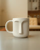 Minimalist White Ceramic Face Mug – Artistic Coffee & Tea Cup